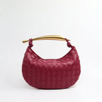 Elyra Woven Curve Handbag